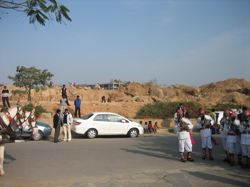 servants watching from rubble