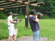 Barry with AR-15 using spotting scope to look at target, Doug with Dragunov