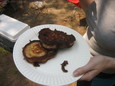Pancakes fried in bacon grease over a camp fire.