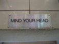 "mind your head" sign at McDonalds